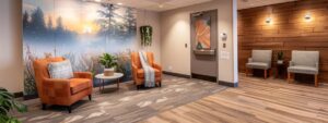 a serene, modern counseling office with warm, inviting colors, featuring a plush armchair and a calming wall mural, conveying a sense of safety and openness for anger management therapy.